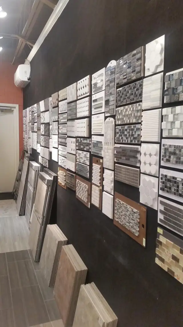 Tile sample wall at The Bath Remodeling Center showroom in downtown Cary, NC